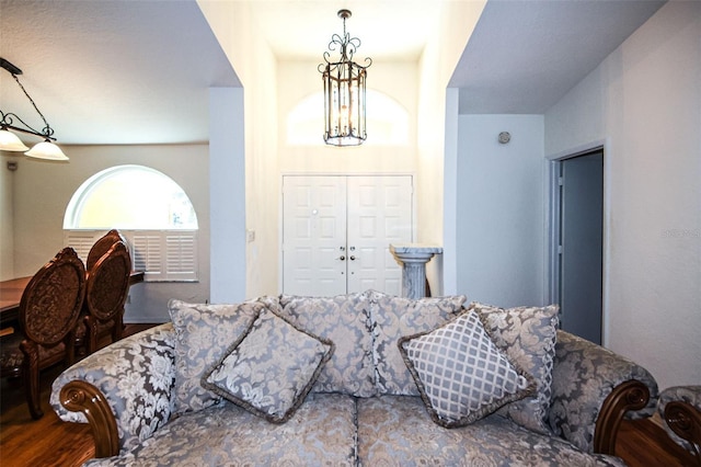 living room featuring a notable chandelier