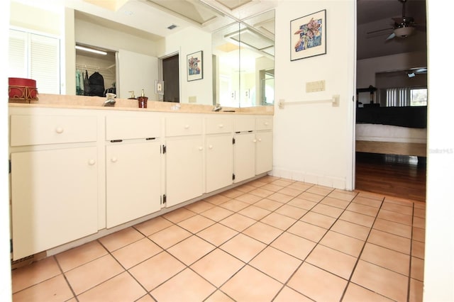 bathroom featuring visible vents, connected bathroom, a ceiling fan, tile patterned flooring, and vanity