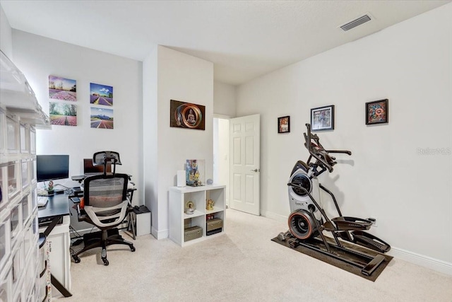 office space featuring carpet, visible vents, and baseboards