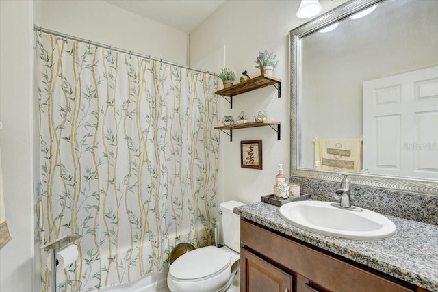 full bathroom with shower / tub combo with curtain, vanity, and toilet