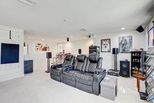 living room featuring a textured ceiling, visible vents, carpet flooring, and recessed lighting