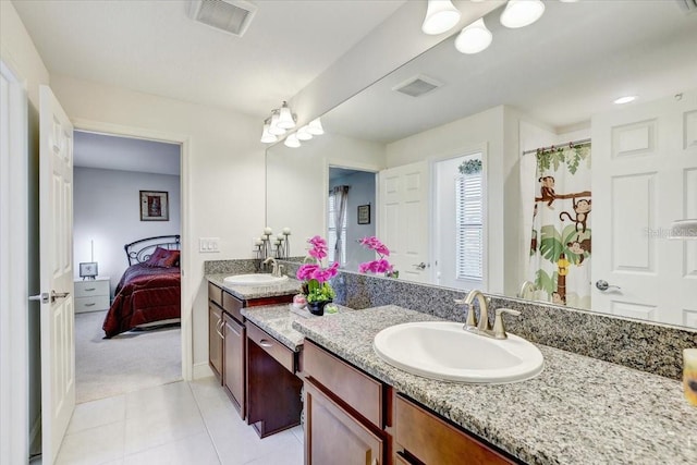 full bath with tile patterned floors, vanity, visible vents, and connected bathroom