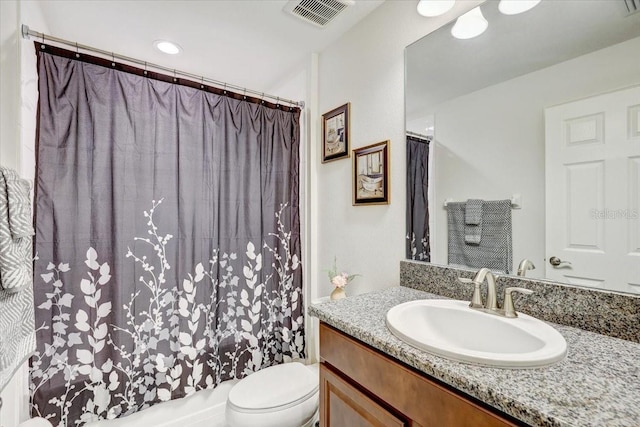 bathroom featuring visible vents, vanity, and toilet