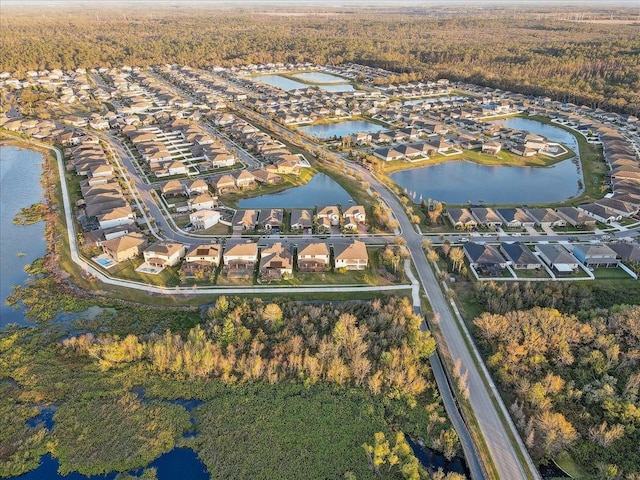 birds eye view of property featuring a residential view and a water view