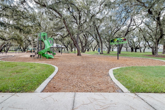 community jungle gym featuring a yard