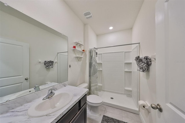 full bathroom with a stall shower, visible vents, toilet, tile patterned floors, and vanity