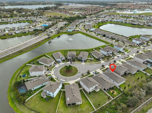 bird's eye view featuring a residential view and a water view