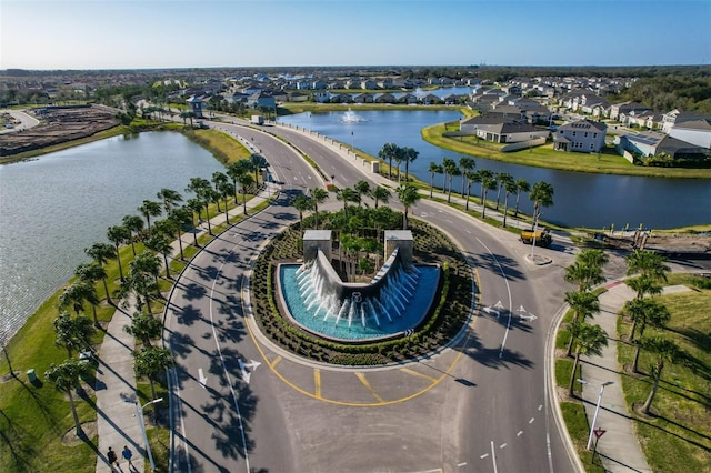 bird's eye view with a water view and a residential view