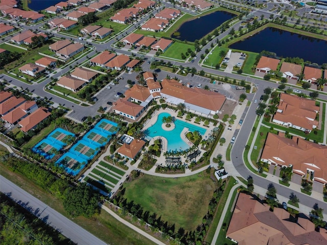 birds eye view of property featuring a water view and a residential view