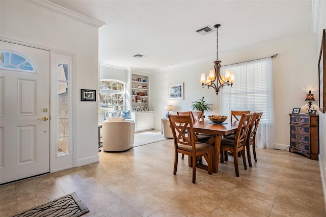 dining room with visible vents, a healthy amount of sunlight, an inviting chandelier, and ornamental molding