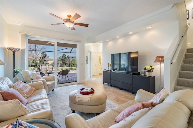 living room featuring stairway, baseboards, recessed lighting, ornamental molding, and ceiling fan