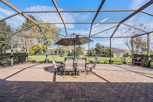 view of patio featuring a lanai