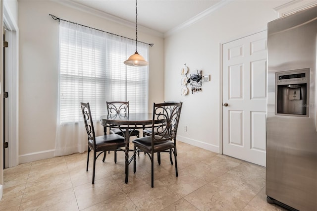 dining area with light tile patterned floors, baseboards, and crown molding