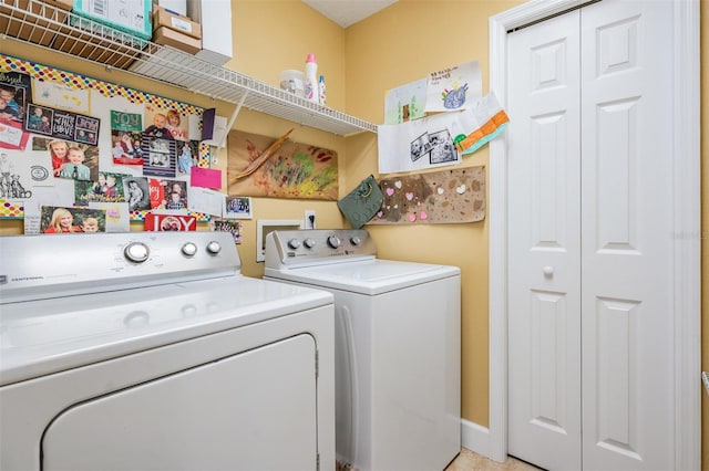 laundry area featuring washer and clothes dryer and laundry area