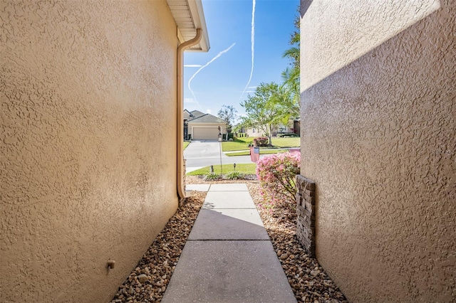 view of property exterior featuring stucco siding and a residential view