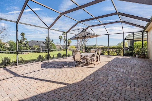 view of patio / terrace featuring glass enclosure