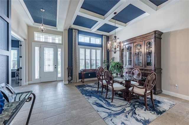 dining room with a chandelier, coffered ceiling, beamed ceiling, and baseboards