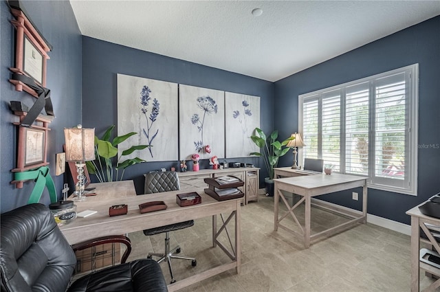 office with a textured ceiling and baseboards