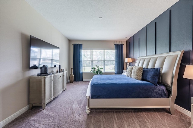 bedroom with carpet floors and baseboards