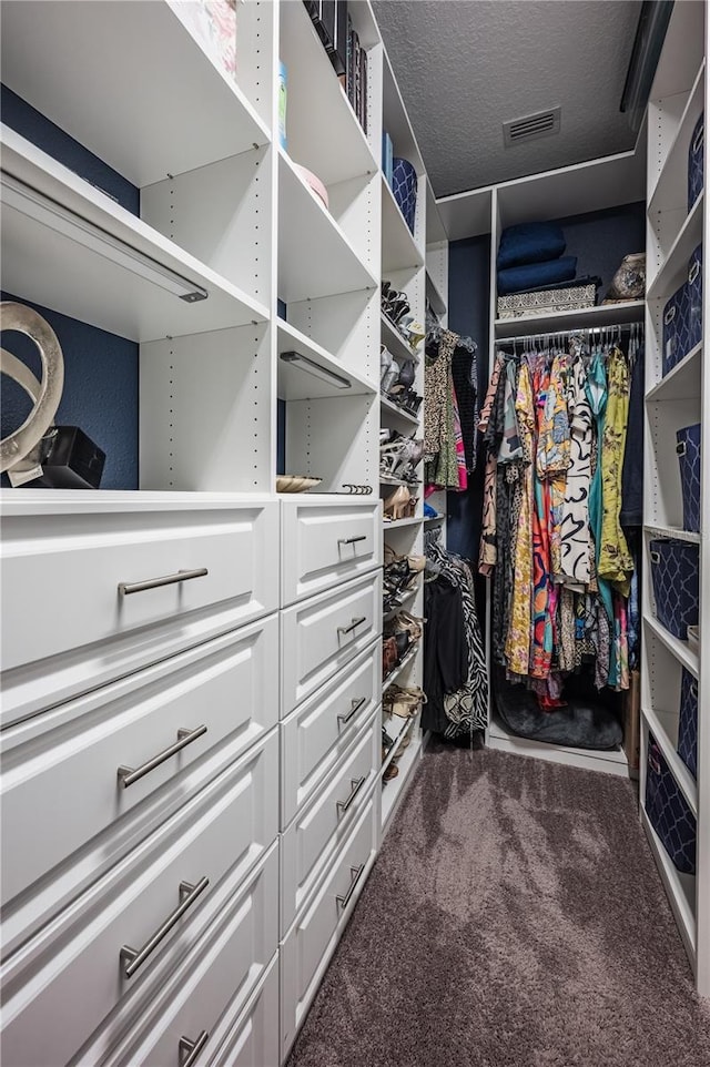 walk in closet with carpet flooring and visible vents