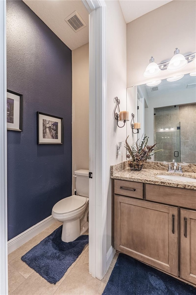 full bath with a stall shower, visible vents, tile patterned floors, and baseboards