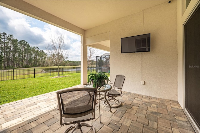 view of patio featuring fence