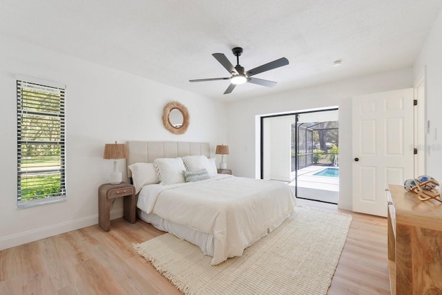 bedroom featuring baseboards, a ceiling fan, a sunroom, access to outside, and light wood-style floors