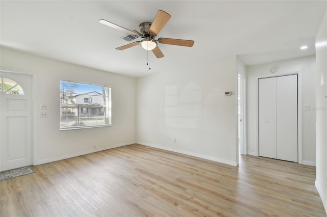 entrance foyer featuring light wood finished floors, visible vents, and baseboards