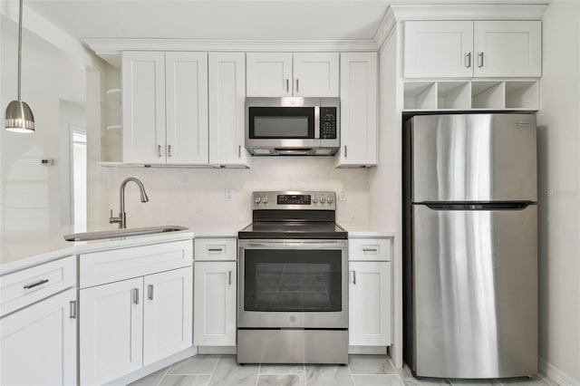 kitchen with open shelves, a sink, stainless steel appliances, light countertops, and white cabinetry