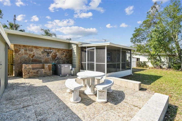 view of patio / terrace with a sunroom