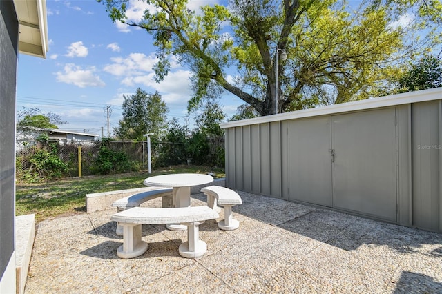 view of patio featuring fence