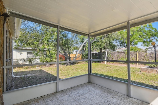 unfurnished sunroom with a wealth of natural light