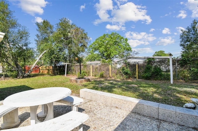 view of yard featuring a patio area and a fenced backyard