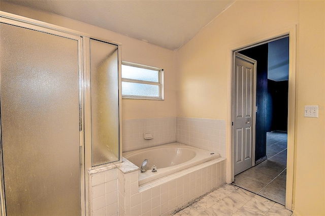 full bathroom with a stall shower, marble finish floor, and a bath