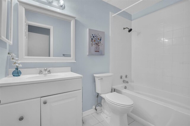 bathroom with toilet, baseboards, shower / washtub combination, and vanity