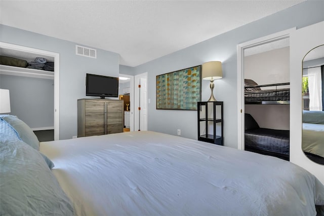 bedroom featuring visible vents