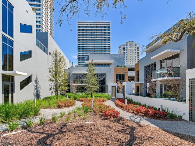 exterior space with a view of city and stucco siding