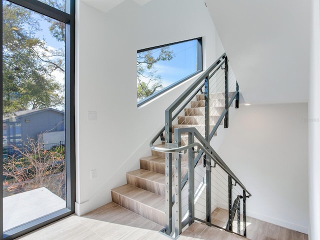 stairs with wood finished floors