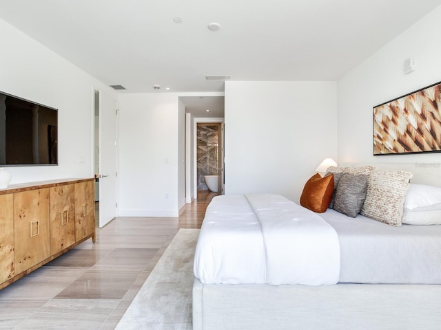 bedroom featuring ensuite bath