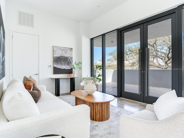 living room featuring visible vents