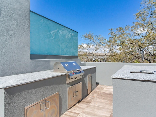 view of patio / terrace featuring exterior kitchen and area for grilling