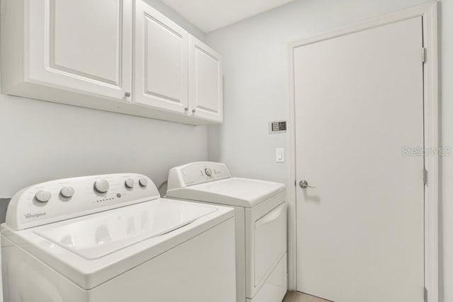 laundry area with cabinet space and washer and dryer