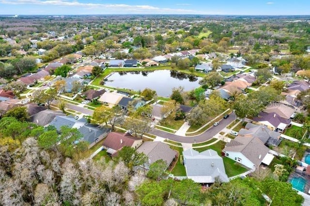 birds eye view of property featuring a residential view and a water view