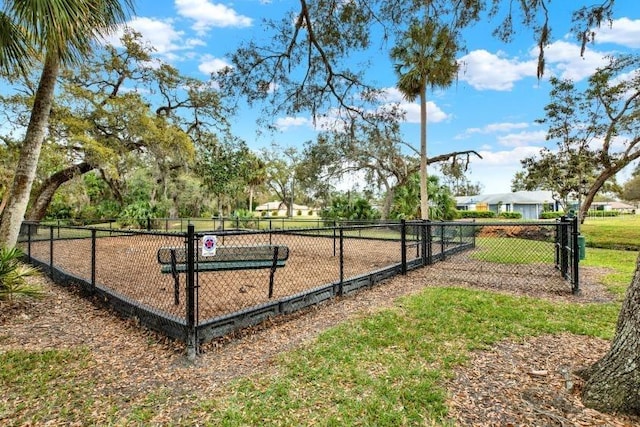 view of community featuring fence