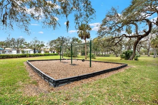 community jungle gym with a yard