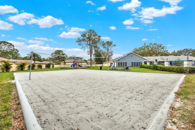 view of property's community with a yard and volleyball court