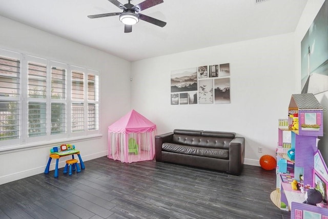 rec room featuring a ceiling fan, baseboards, and wood finished floors