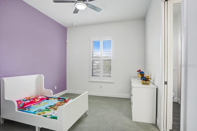 bedroom featuring baseboards and carpet flooring