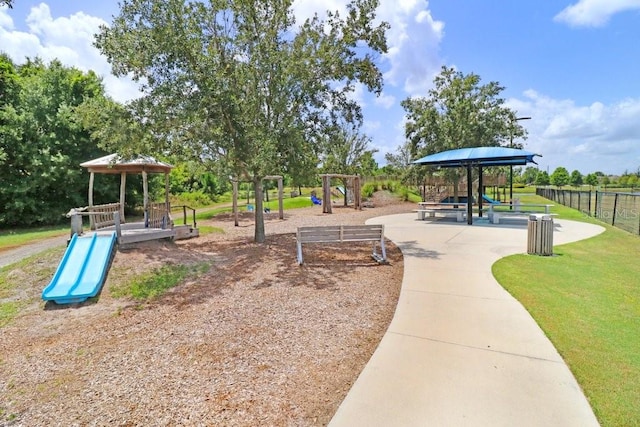 community playground featuring a yard, a gazebo, and fence