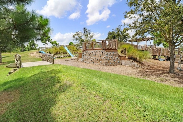 view of play area featuring a lawn